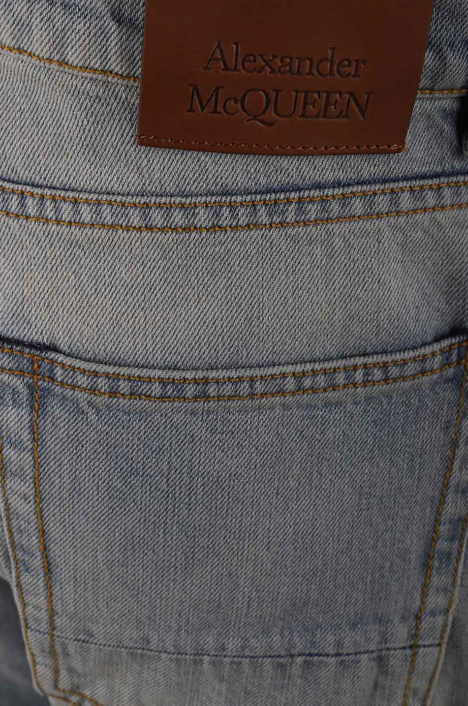 Topstitched faded slim fit jeans