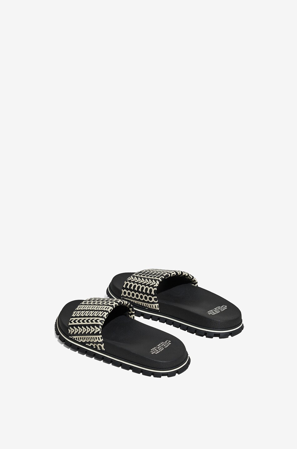 Flache Pantoletten aus Leder The Monogram Slide