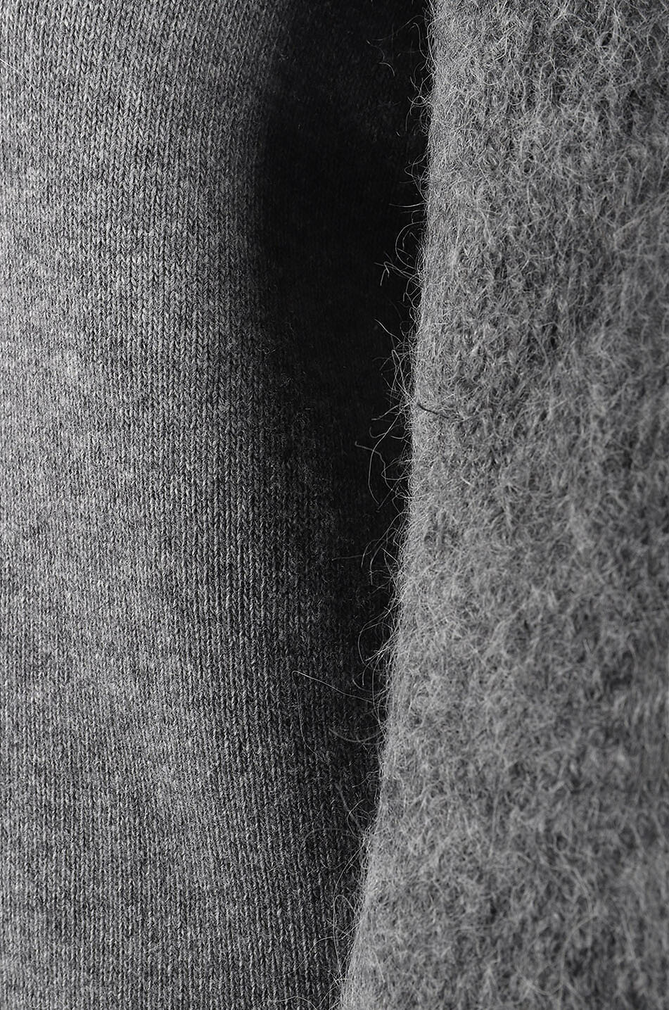 Bi-material jumper with rounded sleeves