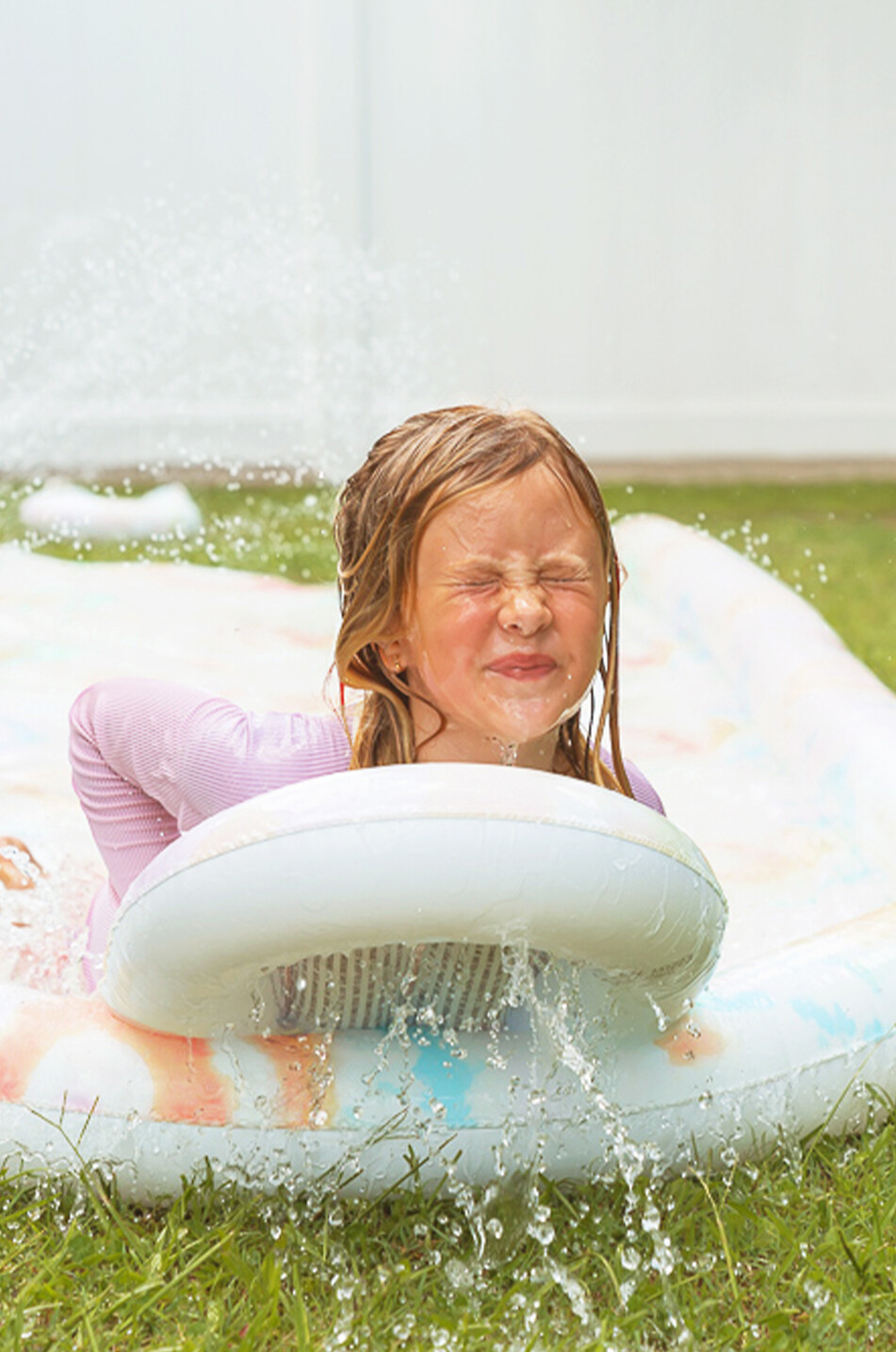 The Tie Dye inflatable slide and bodyboard set