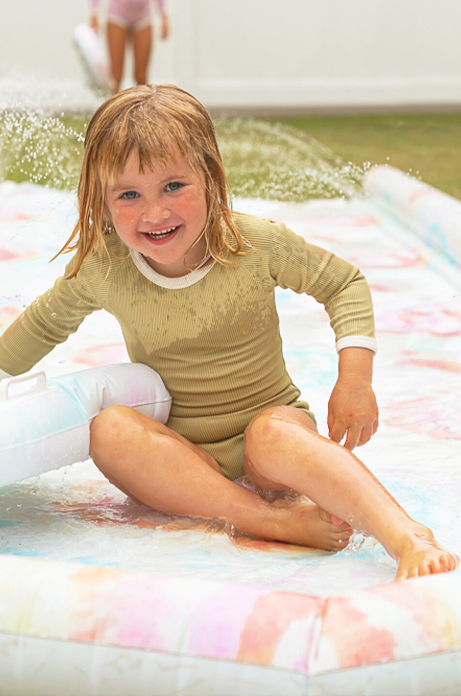 The Tie Dye inflatable slide and bodyboard set