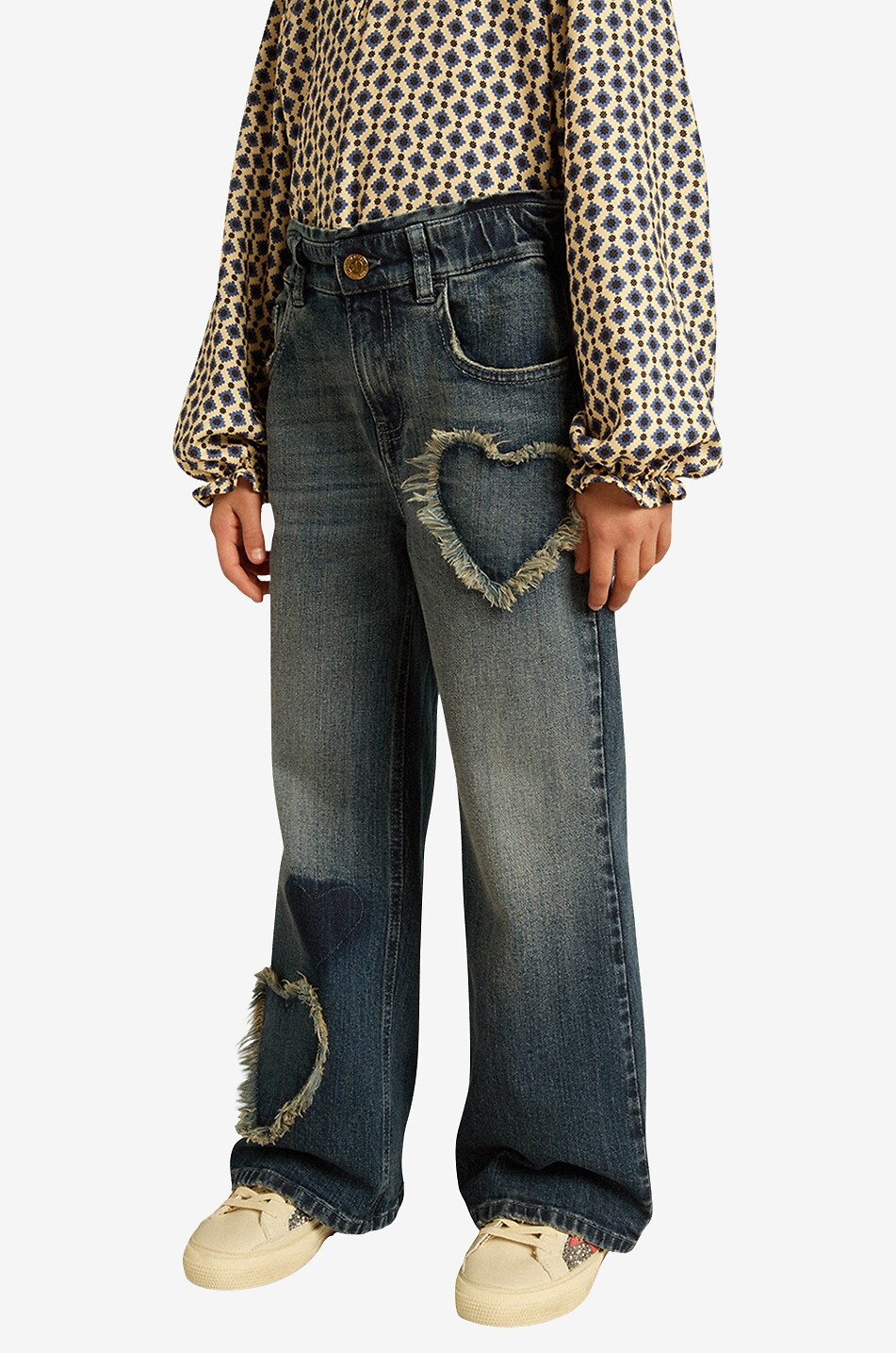 Heart patch adorned girl's faded wide-leg jeans
