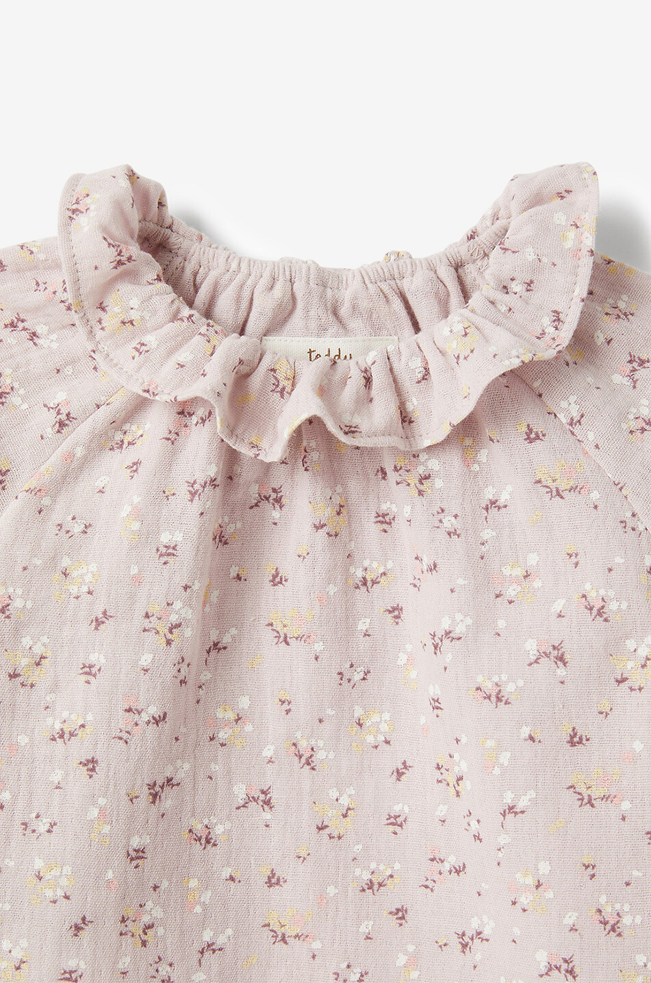 Geblümte Langarm-Babybluse aus Gaze