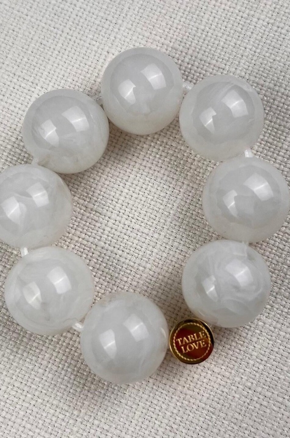 Lot de quatre ronds de serviette Orb