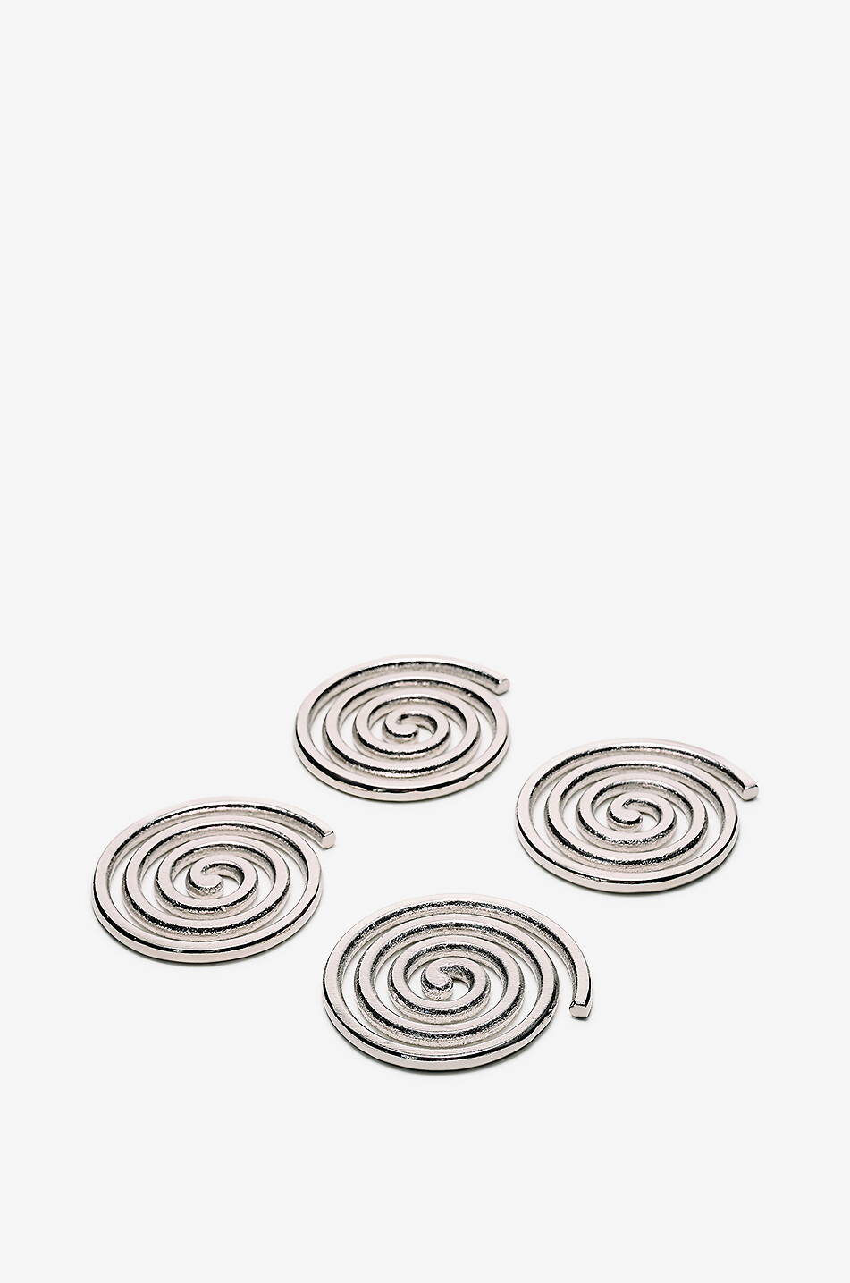 Set of four spiral aluminium coasters
